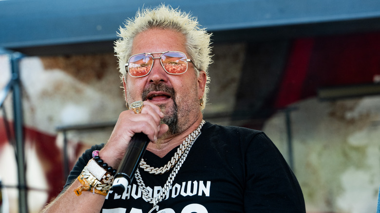 Guy Fieri speaking into a microphone