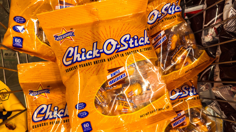 Bags of Chick-O-Stick candy in shopping basket.