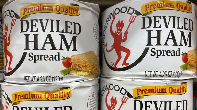 Cans of Underwood deviled ham on a grocery store shelf in Georgia.