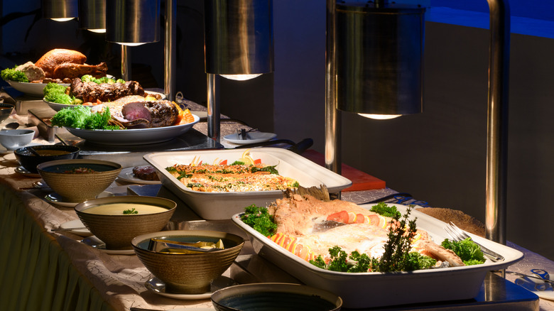 A buffet set-up with foods lined up