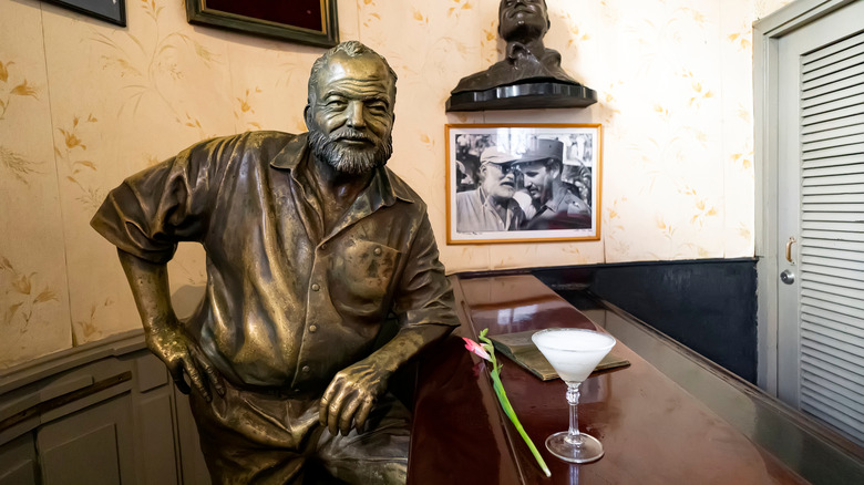 A statue of Ernest Hemingway is "served" a daiquiri at El Floridita in Havana.