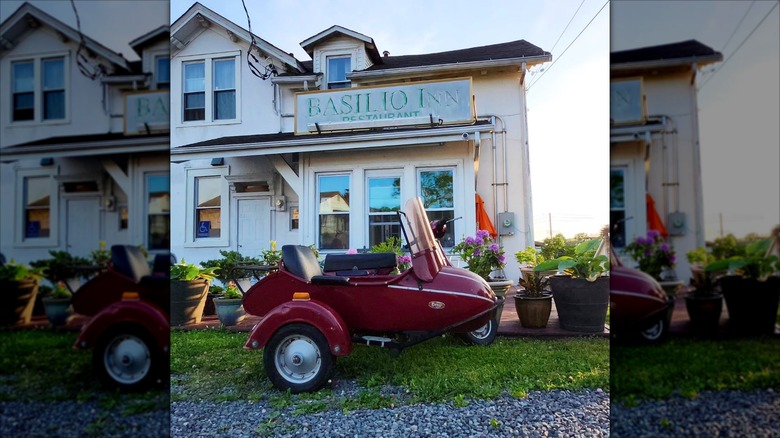 Basilio Inn exterior with Vespa and garden patio