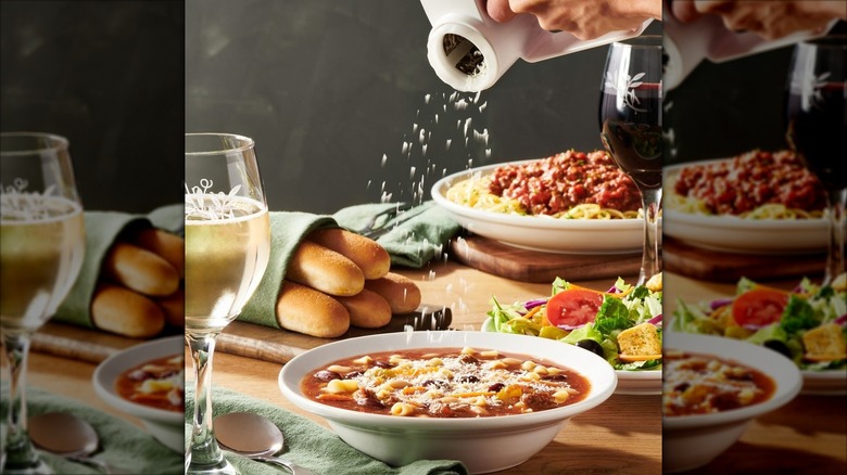 Olive Garden grated cheese sprinkling onto a bowl of soup