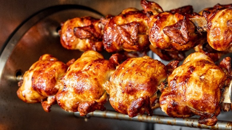 Boston Market chickens roasting on the rotisserie