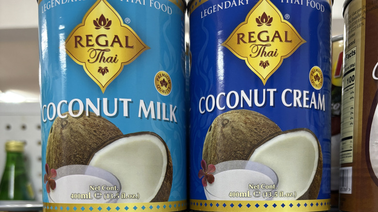 Canned coconut milk on a shelf