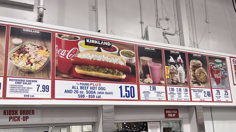 The Costco food court menu prominently displaying the hot dog combo at $1.50