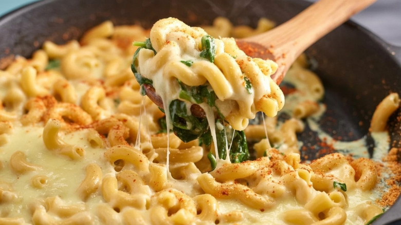 Spoon scooping mac and cheese