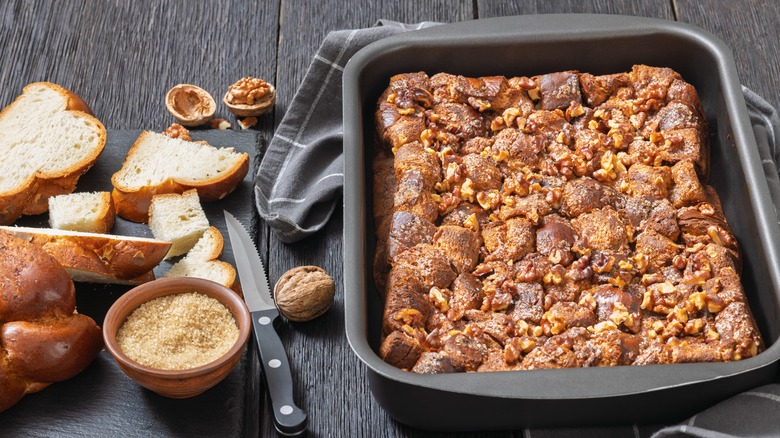 crunchy walnuts streusel topping in a pan with chopped bread on the side