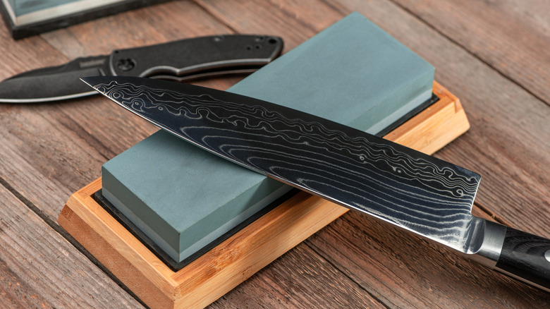 Gyuto knife on a sharpening stone 