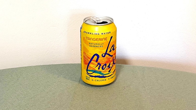 Tangerine La Croix sitting on a table