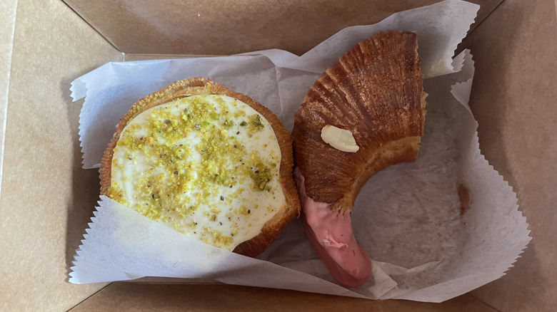 Two pastries in a to-go box from Diljān bakery.