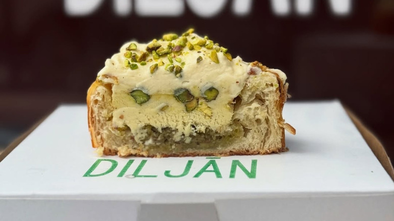 The sheer pira pastry at at Diljān bakery has been cut through the center.