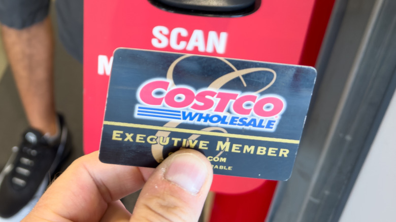 Person scanning Costco Executive member card