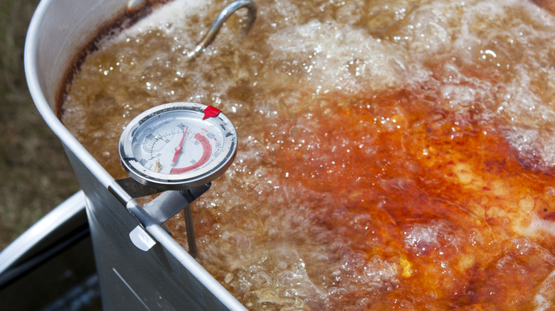 Food frying with oil thermometer