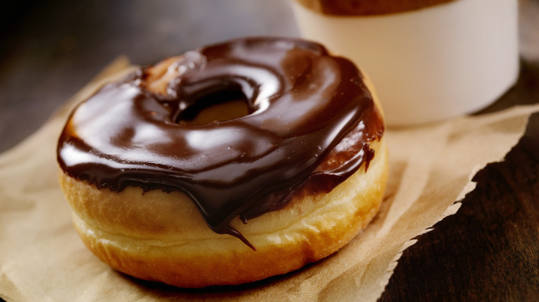 donut covered in shiny chocolate glaze
