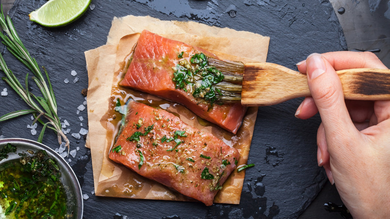 Salmon filets brushed with herbs