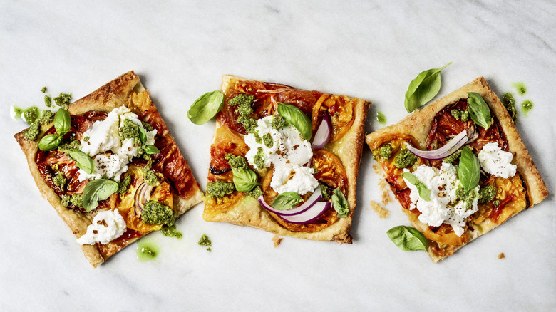 Three squares of flatbread pizza