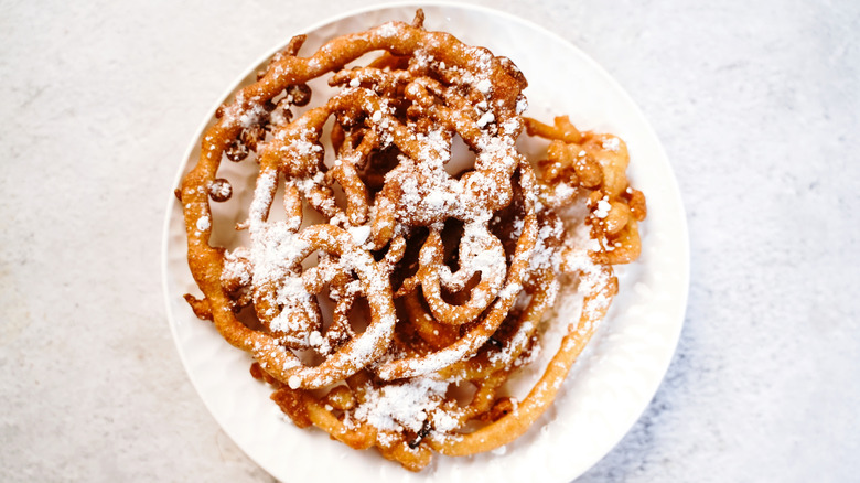 Funnel cake on white plate