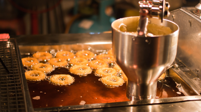 Donut machine making donuts