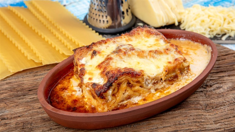 Pan of lasagna with ingredients