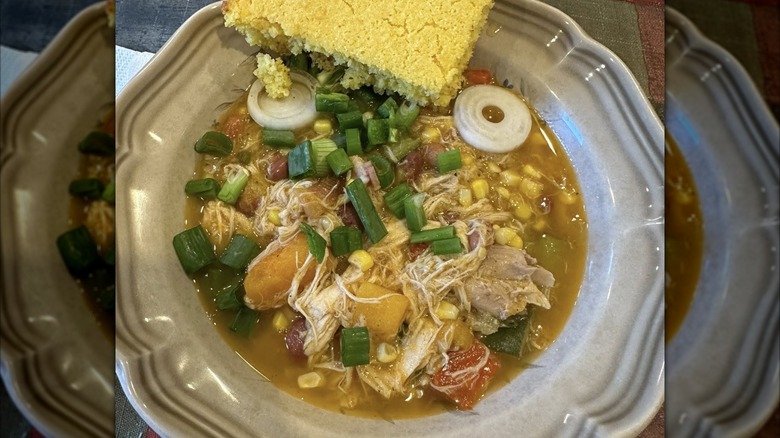 Bowl of Three Sisters soup topped with green onions
