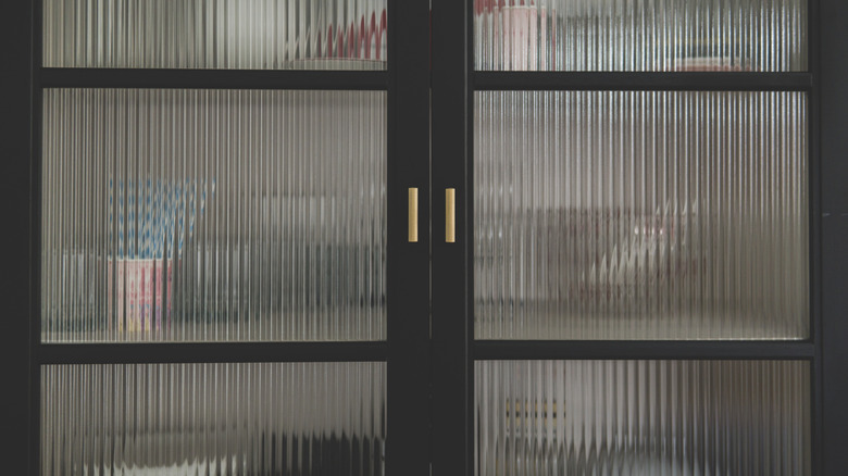 Pantry doors are set with glass panels.