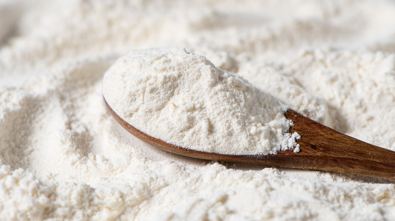 wooden spoon of flour