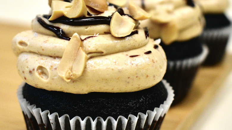 Chocolate cupcakes with peanut butter ganache topping