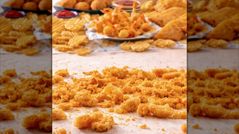 Long John Silver's crunchies with shrimp, fries, and other menu items in the background