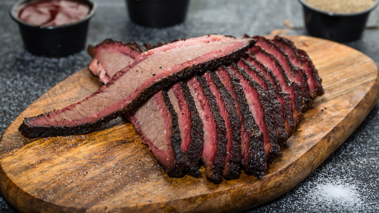 Sliced brisket on wooden board