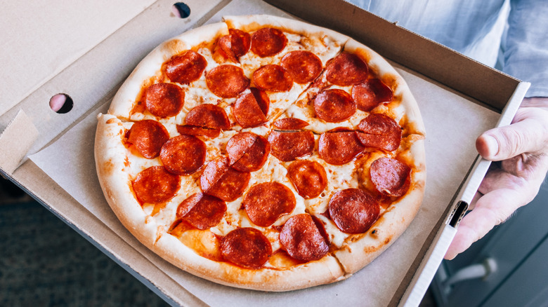 Pepperoni pizza in a to-go box
