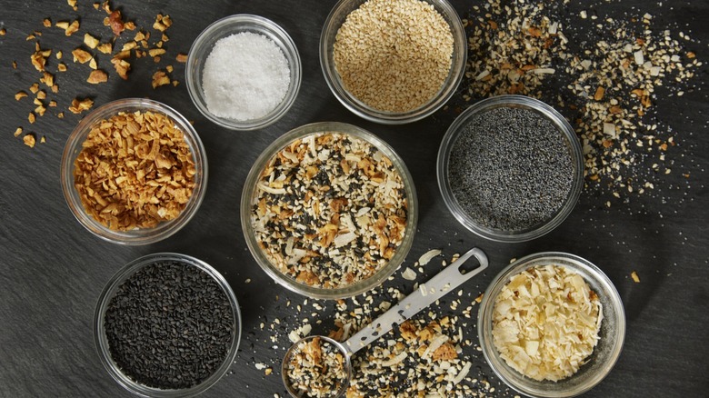 Ingredients for everything seasoning in bowls on table