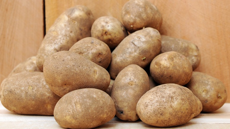 A crate of Russet potatoes.