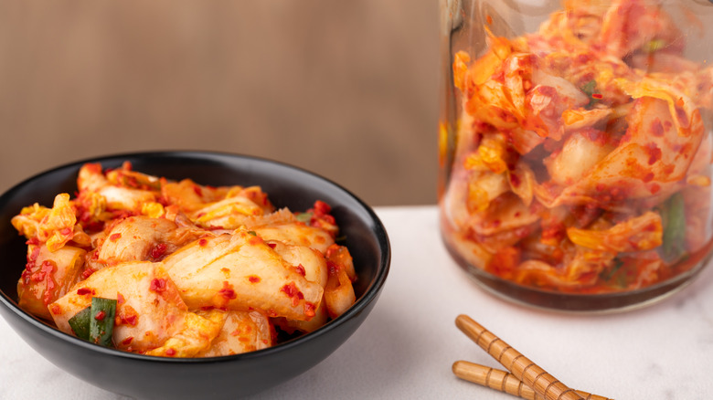 Bowl and jar of kimchi