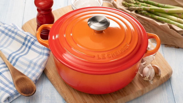 An enameled cast iron covered Dutch oven.