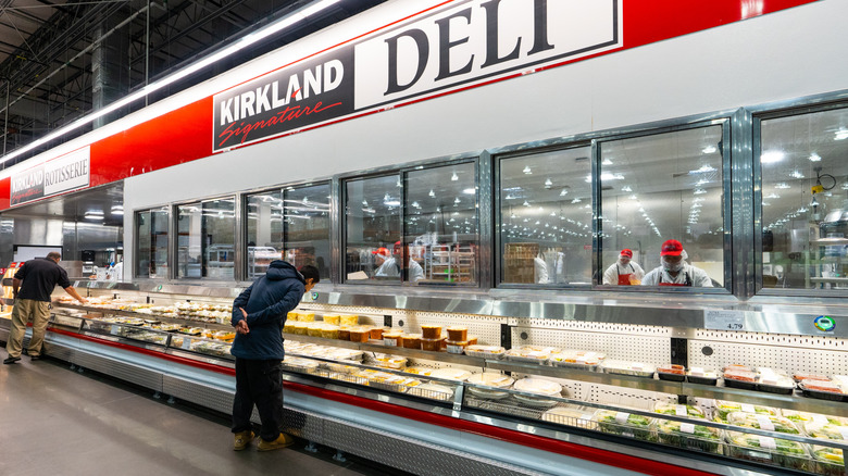 Customers shopping in Costco's deli and refrigerated, prepared foods section