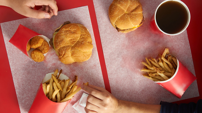 Fast food burger with fries.