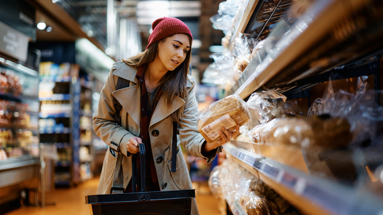 person choosing bread