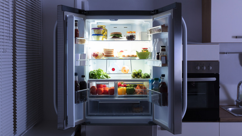 Open fridge displaying fresh produce inside