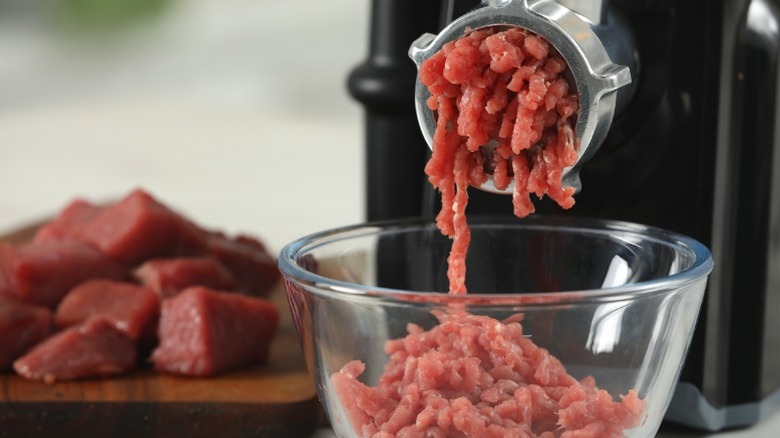 Ground beef coming out of meat grinder