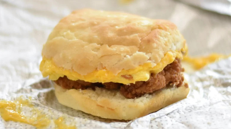 Chick-fil-A chicken, egg, and cheese biscuit sitting on top wrapper