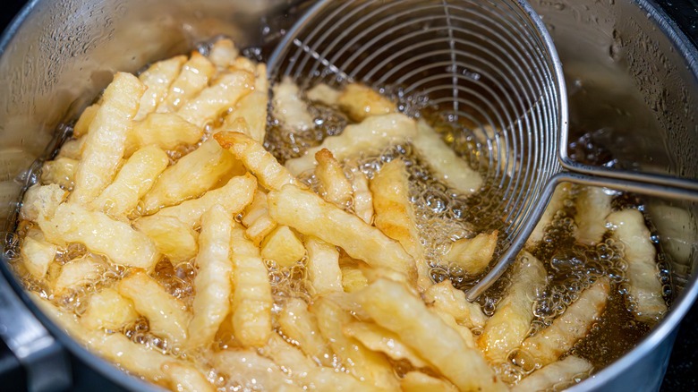 french fries frying in fat