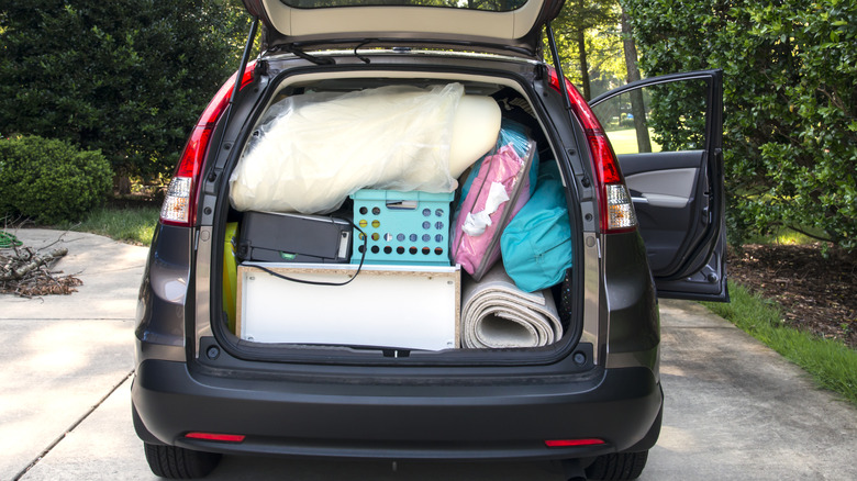 van loaded full of luggage and furniture