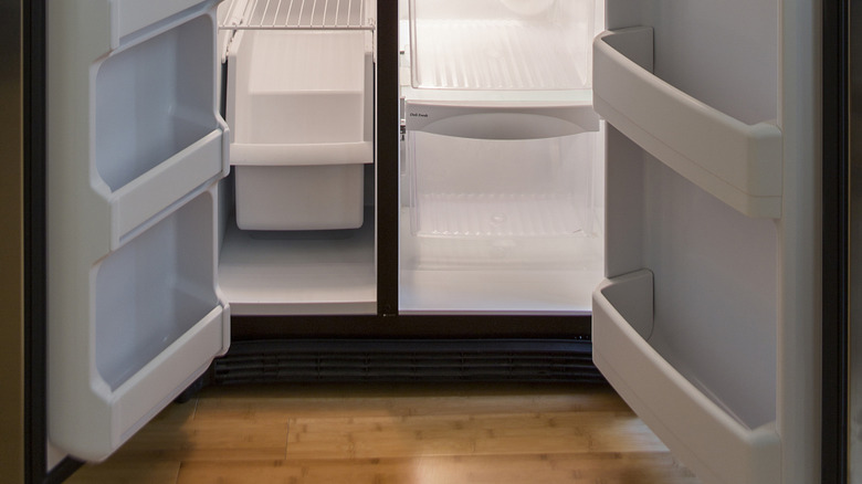 empty fridge with open doors