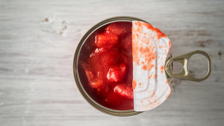 Half open can of tomatoes