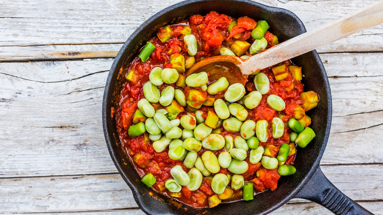 Preparing a meal with a cast iron pan