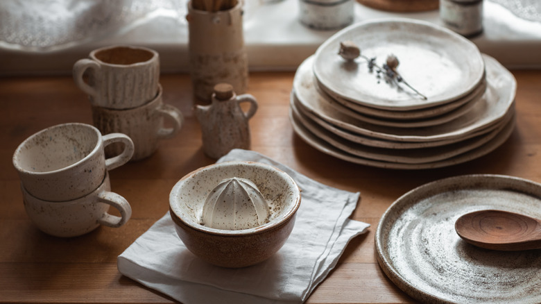 Stoneware pieces including plates and cups