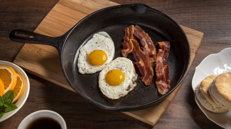 bacon and eggs in pan