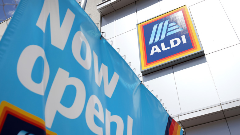 Now open sign displayed outside new Aldi store