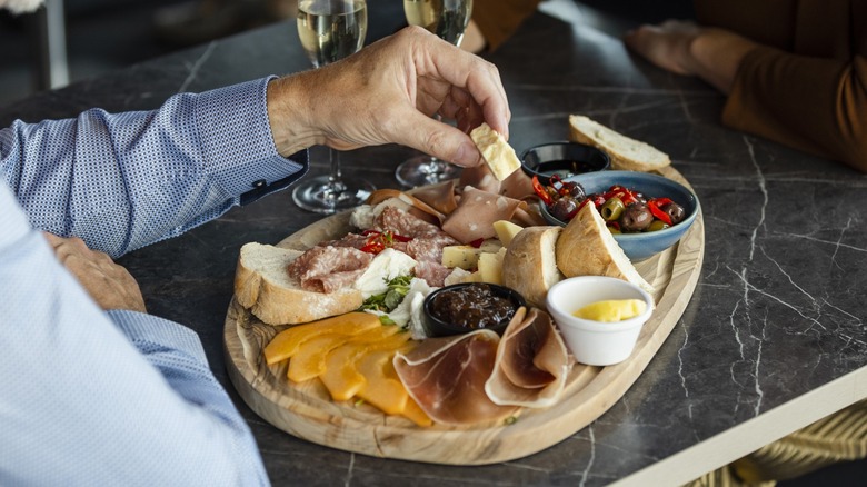 People eating charcuterie in a restaurant